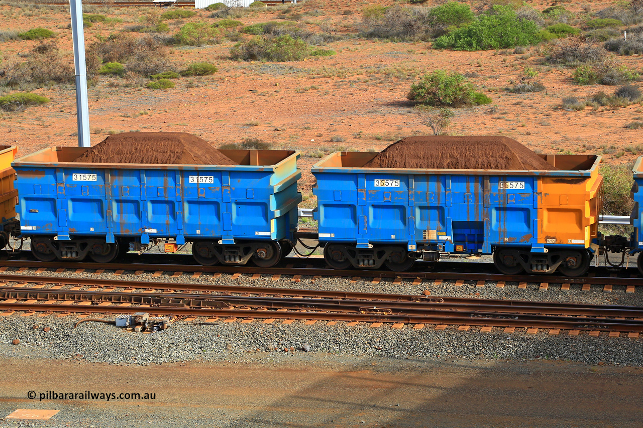 240619 0352
Cape Lambert yard, one of Rio Tinto's blue rakes with spring assisted park brake and only electronic controlled pneumatic [ECP] braking, waggon pair 31575 is a master and is bar coupled to slave waggon 36575 built by China Northen as a Q type in 12/2022. Captured on June 19, 2024.
Keywords: 31575;36575;Q-type;China-Northern;Rio-ore-waggon;