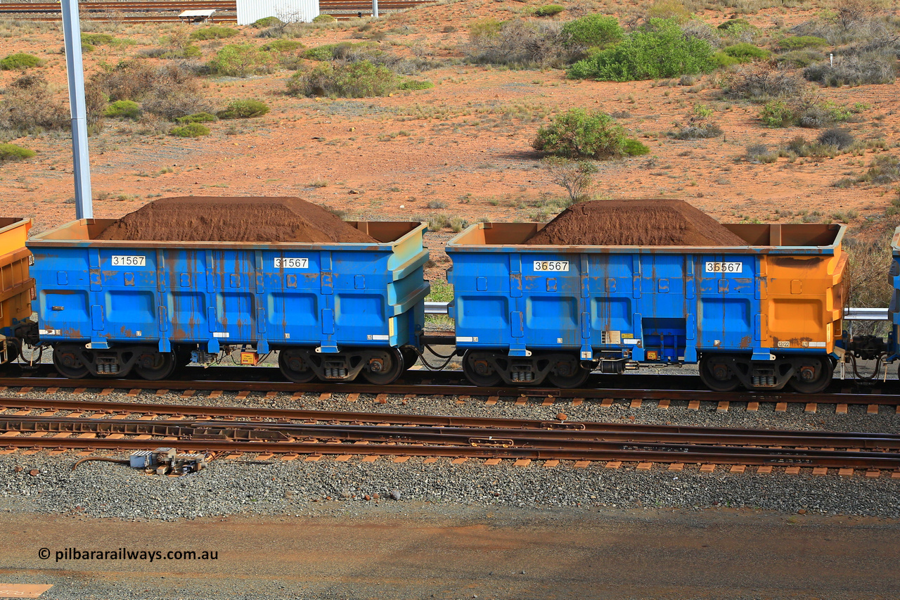 240619 0355
Cape Lambert yard, one of Rio Tinto's blue rakes with spring assisted park brake and only electronic controlled pneumatic [ECP] braking, waggon pair 31567 is a master and is bar coupled to slave waggon 36567 built by China Northen as a Q type in 12/2022. Captured on June 19, 2024.
Keywords: 31567;36567;Q-type;China-Northern;Rio-ore-waggon;