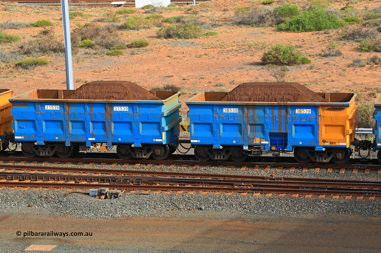 240619 0356
Cape Lambert yard, one of Rio Tinto's blue rakes with spring assisted park brake and only electronic controlled pneumatic [ECP] braking, waggon pair 31539 is a master and is bar coupled to slave waggon 36539 built by China Northen as a Q type in 12/2022. Captured on June 19, 2024.
Keywords: 31539;36539;Q-type;China-Northern;Rio-ore-waggon;