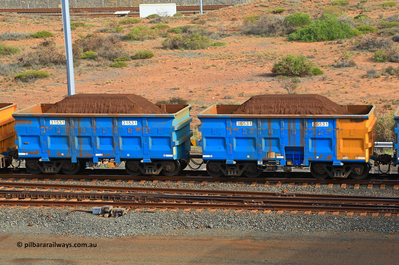 240619 0361
Cape Lambert yard, one of Rio Tinto's blue rakes with spring assisted park brake and only electronic controlled pneumatic [ECP] braking, waggon pair 31531 is a master and is bar coupled to slave waggon 36531 built by China Northen as a Q type in 12/2022. Captured on June 19, 2024.
Keywords: 31531;36531;Q-type;China-Northern;Rio-ore-waggon;