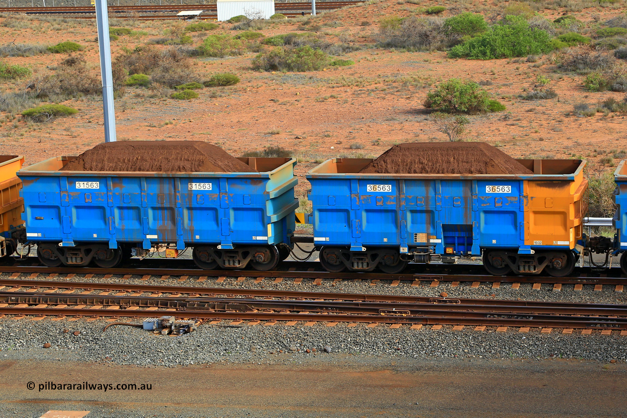 240619 0371
Cape Lambert yard, one of Rio Tinto's blue rakes with spring assisted park brake and only electronic controlled pneumatic [ECP] braking, waggon pair 31563 is a master and is bar coupled to slave waggon 36563 built by China Northen as a Q type in 12/2022. Captured on June 19, 2024.
Keywords: 31563;36563;Q-type;China-Northern;Rio-ore-waggon;