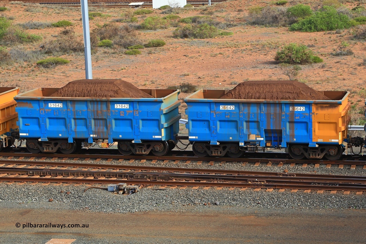 240619 0372
Cape Lambert yard, one of Rio Tinto's blue rakes with spring assisted park brake and only electronic controlled pneumatic [ECP] braking, waggon pair 31642 is a master and is bar coupled to slave waggon 36642 built by China Northen as a Q type in 11/2022. Captured on June 19, 2024.
Keywords: 31642;36642;Q-type;China-Northern;Rio-ore-waggon;