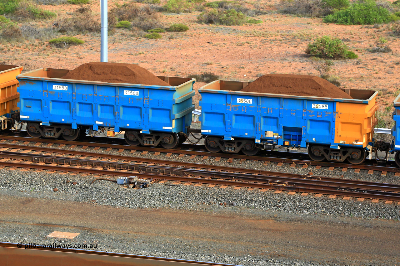 240619 0402
Cape Lambert yard, one of Rio Tinto's blue rakes with spring assisted park brake and only electronic controlled pneumatic [ECP] braking, waggon pair 31588 is a master and is bar coupled to slave waggon 36588 built by China Northen as a Q type in 11/2022. Captured on June 19, 2024.
Keywords: 31588;36588;Q-type;China-Northern;Rio-ore-waggon;