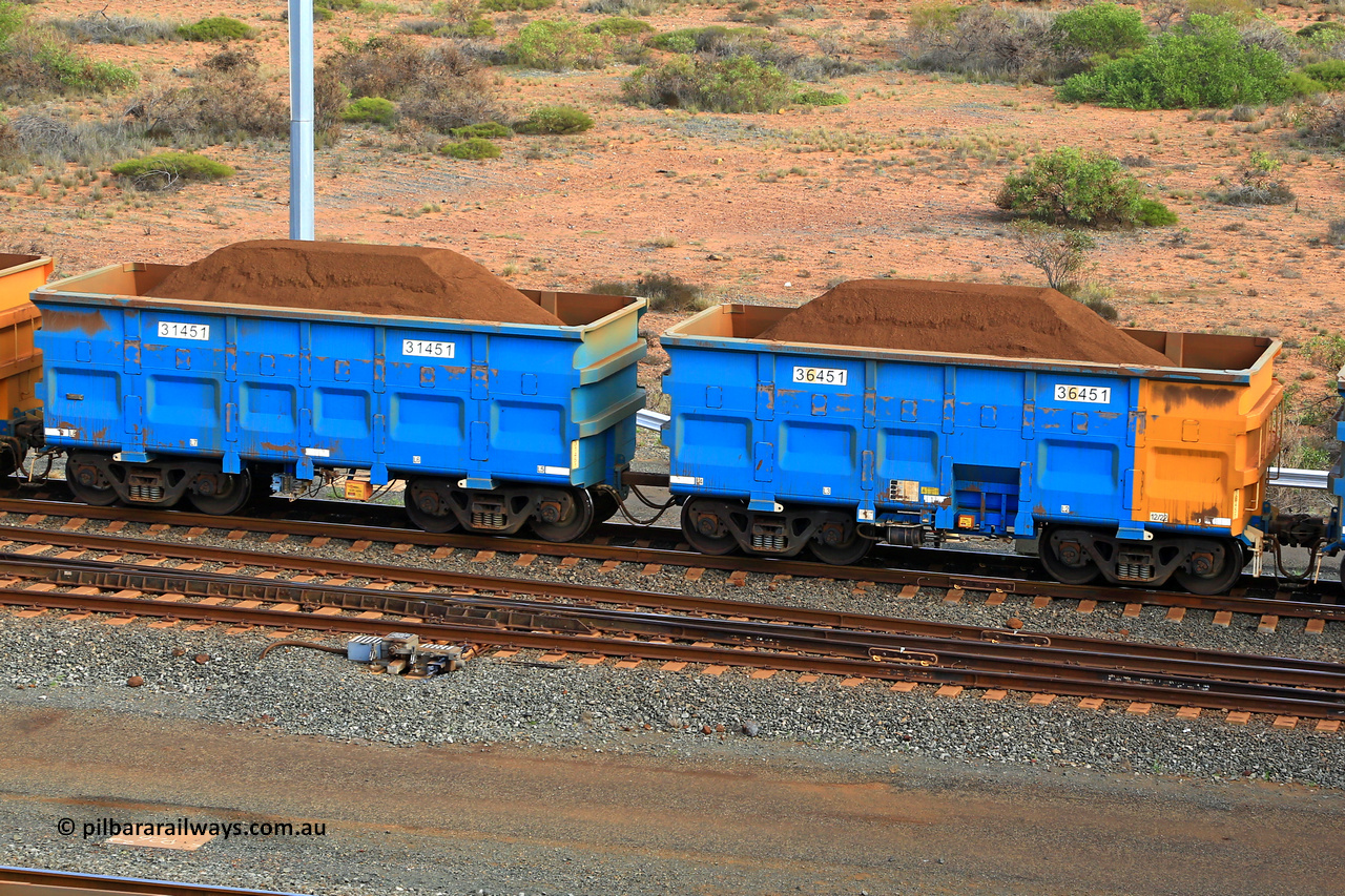 240619 0418
Cape Lambert yard, one of Rio Tinto's blue rakes with spring assisted park brake and only electronic controlled pneumatic [ECP] braking, waggon pair 31451 is a master and is bar coupled to slave waggon 36451 built by China Northen as a Q type in 12/2022. Captured on June 19, 2024.
Keywords: 31451;36451;Q-type;China-Northern;Rio-ore-waggon;