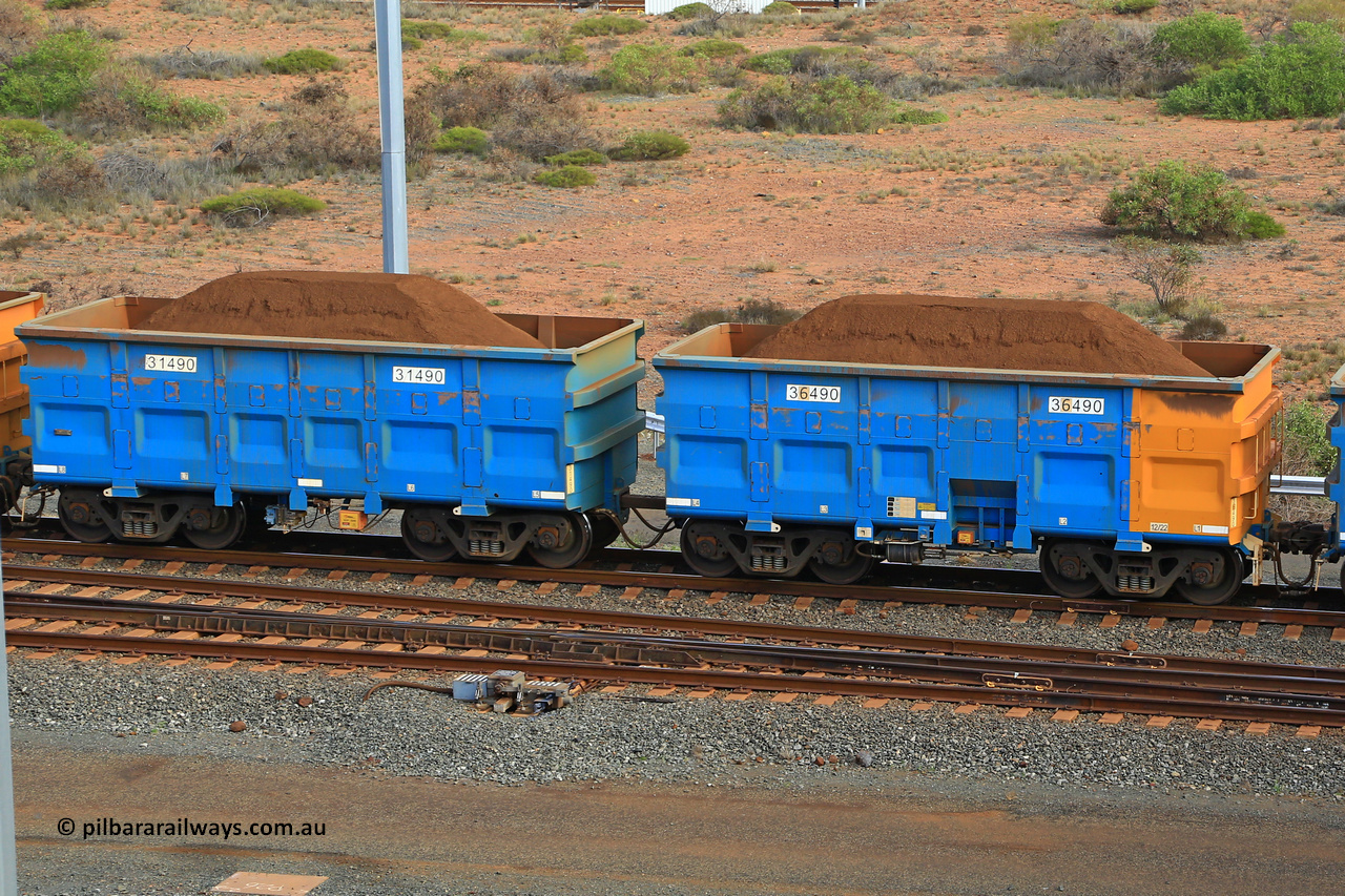 240619 0428
Cape Lambert yard, one of Rio Tinto's blue rakes with spring assisted park brake and only electronic controlled pneumatic [ECP] braking, waggon pair 31490 is a master and is bar coupled to slave waggon 36490 built by China Northen as a Q type in 12/2022. Captured on June 19, 2024.
Keywords: 31490;36490;Q-type;China-Northern;Rio-ore-waggon;