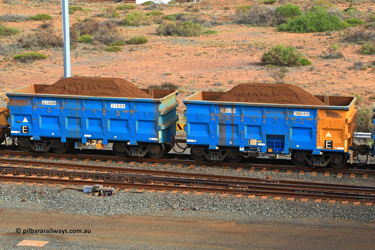 240619 0456
Cape Lambert yard, one of Rio Tinto's blue rakes with spring assisted park brake and only electronic controlled pneumatic [ECP] braking, waggon pair 31688 is a master and is bar coupled to slave waggon 36688 built by China Northen as a Q type in 11/2022. Captured on June 19, 2024.
Keywords: 31688;36688;Q-type;China-Northern;Rio-ore-waggon;