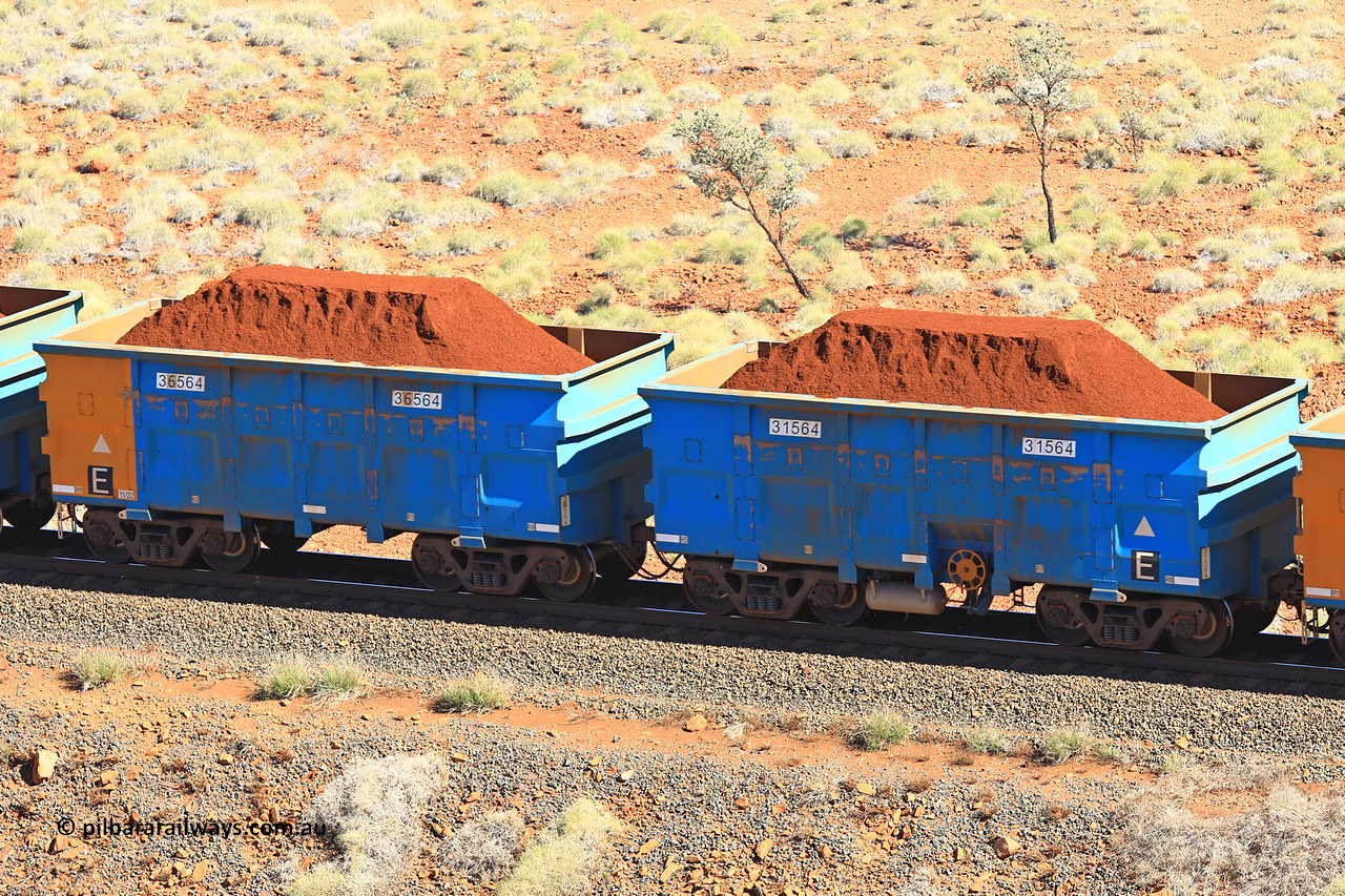240701 2387
Western Creek, 67 km, one of Rio Tinto's blue rakes with spring assisted park brake and only electronic controlled pneumatic [ECP] braking, waggon pair 31564 is a master and is bar coupled to slave waggon 36564 built by China Northen as a Q type in 11/2022. Captured on July 1, 2024.
Keywords: 31564;36564;Q-type;China-Northern;Rio-ore-waggon;