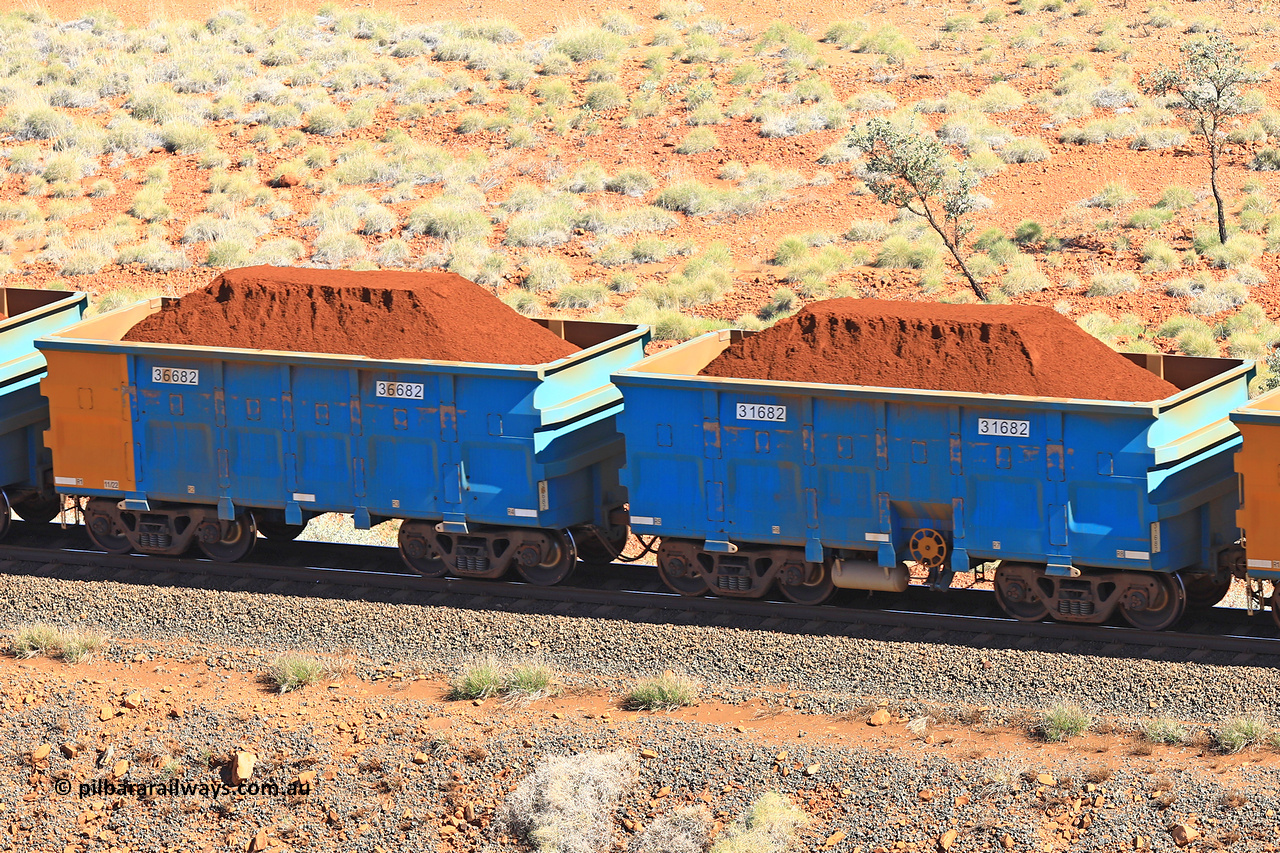 240701 2391
Western Creek, 67 km, one of Rio Tinto's blue rakes with spring assisted park brake and only electronic controlled pneumatic [ECP] braking, waggon pair 31682 is a master and is bar coupled to slave waggon 36682 built by China Northen as a Q type in 11/2022. Captured on July 1, 2024.
Keywords: 31682;36682;Q-type;China-Northern;Rio-ore-waggon;