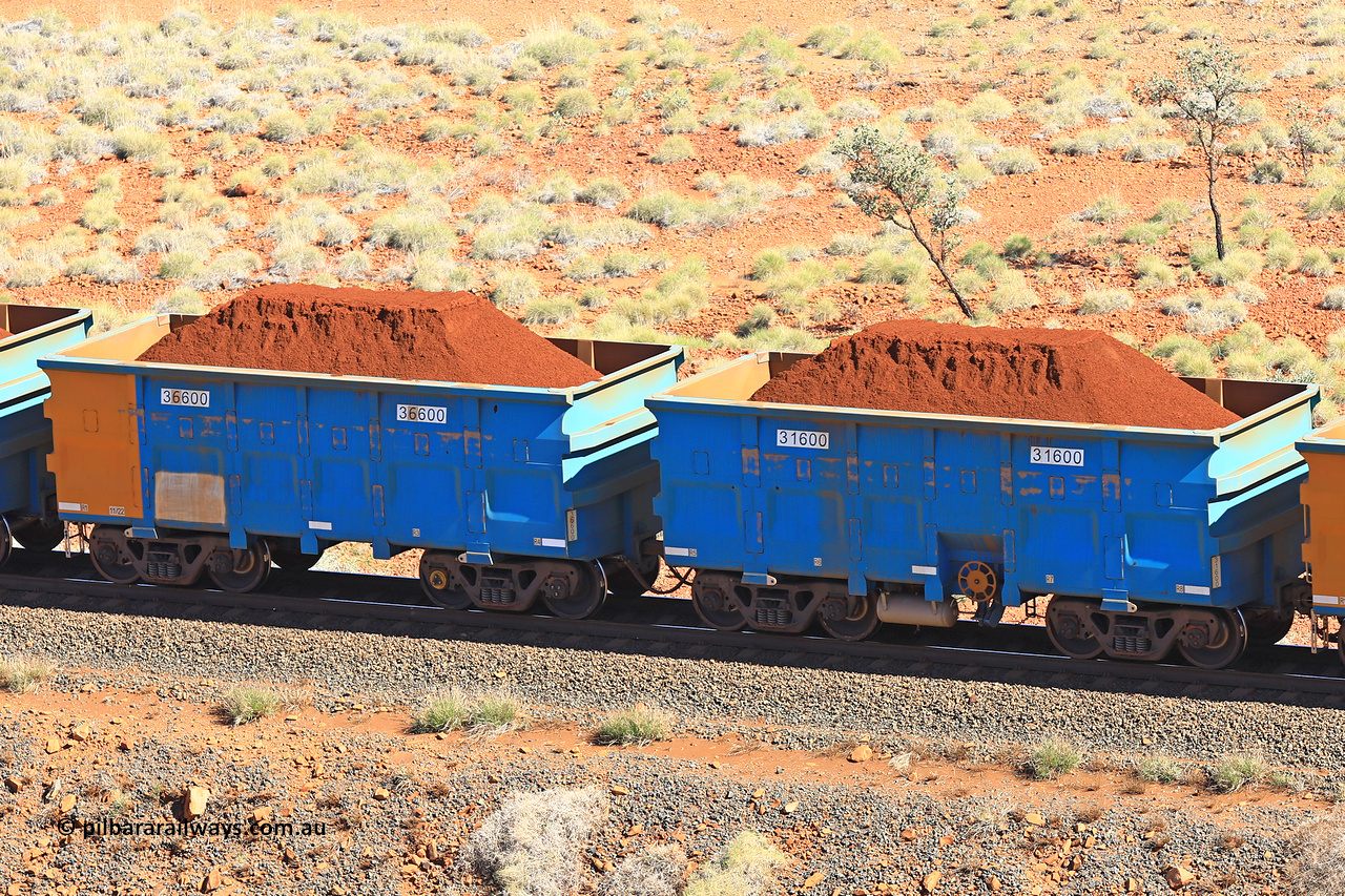 240701 2396
Western Creek, 67 km, one of Rio Tinto's blue rakes with spring assisted park brake and only electronic controlled pneumatic [ECP] braking, waggon pair 31600 is a master and is bar coupled to slave waggon 36600 built by China Northen as a Q type in 11/2022. Captured on July 1, 2024.
Keywords: 31600;36600;Q-type;China-Northern;Rio-ore-waggon;