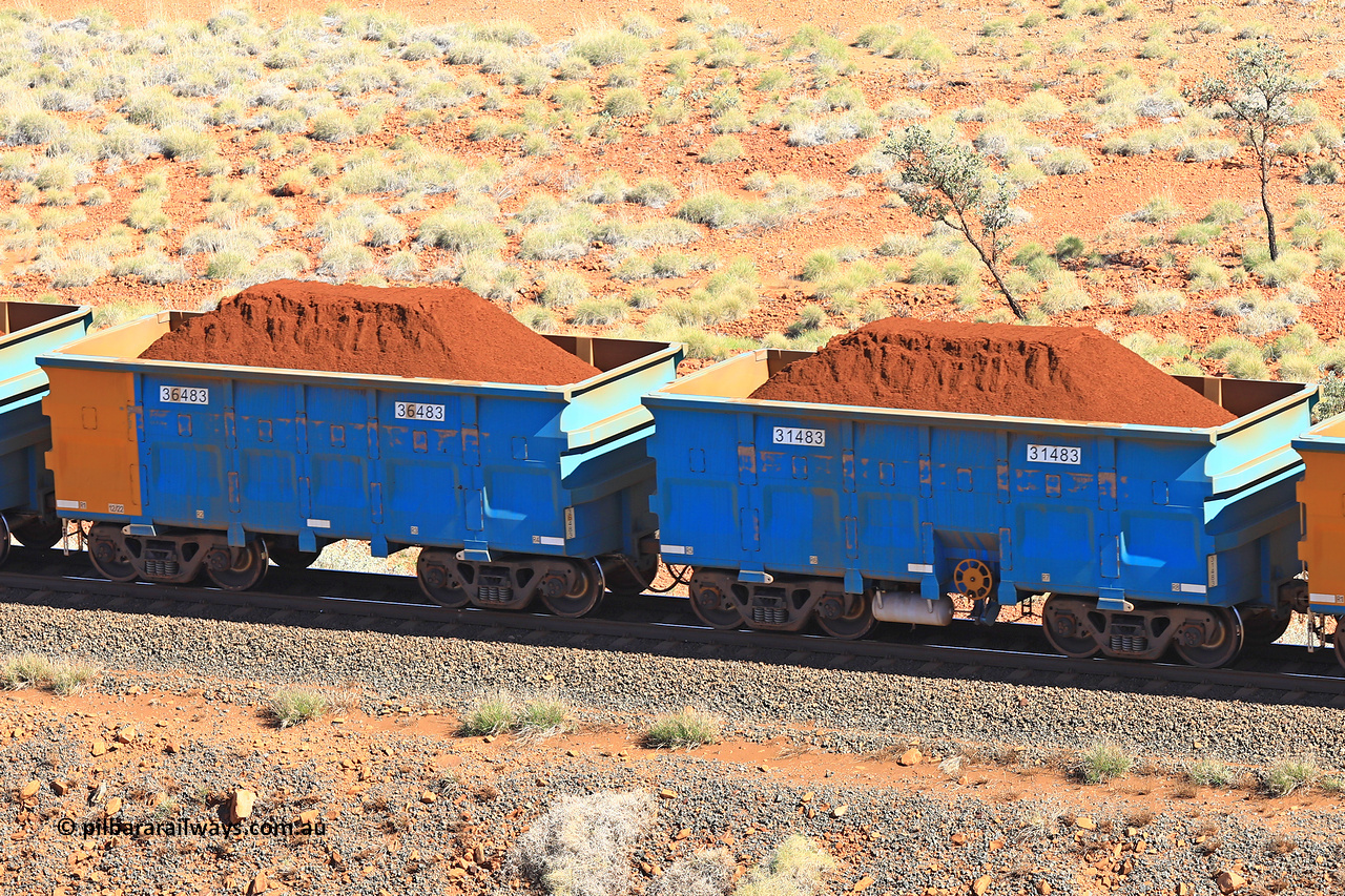 240701 2398
Western Creek, 67 km, one of Rio Tinto's blue rakes with spring assisted park brake and only electronic controlled pneumatic [ECP] braking, waggon pair 31483 is a master and is bar coupled to slave waggon 36483 built by China Northen as a Q type in 12/2022. Captured on July 1, 2024.
Keywords: 31483;36483;Q-type;China-Northern;Rio-ore-waggon;