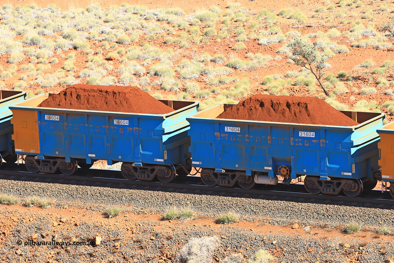 240701 2401
Western Creek, 67 km, one of Rio Tinto's blue rakes with spring assisted park brake and only electronic controlled pneumatic [ECP] braking, waggon pair 31604 is a master and is bar coupled to slave waggon 36604 built by China Northen as a Q type in 11/2022. Captured on July 1, 2024.
Keywords: 31604;36604;Q-type;China-Northern;Rio-ore-waggon;