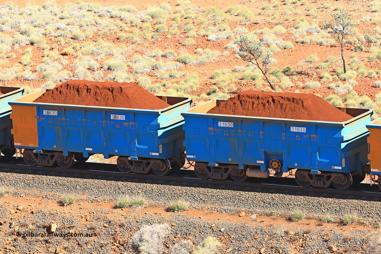 240701 2407
Western Creek, 67 km, one of Rio Tinto's blue rakes with spring assisted park brake and only electronic controlled pneumatic [ECP] braking, waggon pair 31630 is a master and is bar coupled to slave waggon 36630 built by China Northen as a Q type in 11/2022. Captured on July 1, 2024.
Keywords: 31630;36630;Q-type;China-Northern;Rio-ore-waggon;