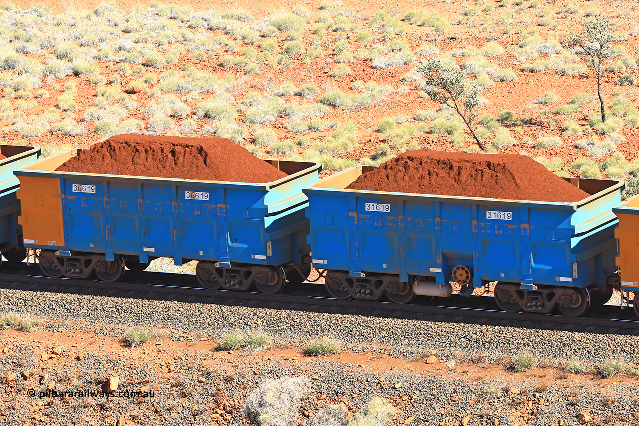 240701 2410
Western Creek, 67 km, one of Rio Tinto's blue rakes with spring assisted park brake and only electronic controlled pneumatic [ECP] braking, waggon pair 31619 is a master and is bar coupled to slave waggon 36619 built by China Northen as a Q type in 11/2022. Captured on July 1, 2024.
Keywords: 31619;36619;Q-type;China-Northern;Rio-ore-waggon;