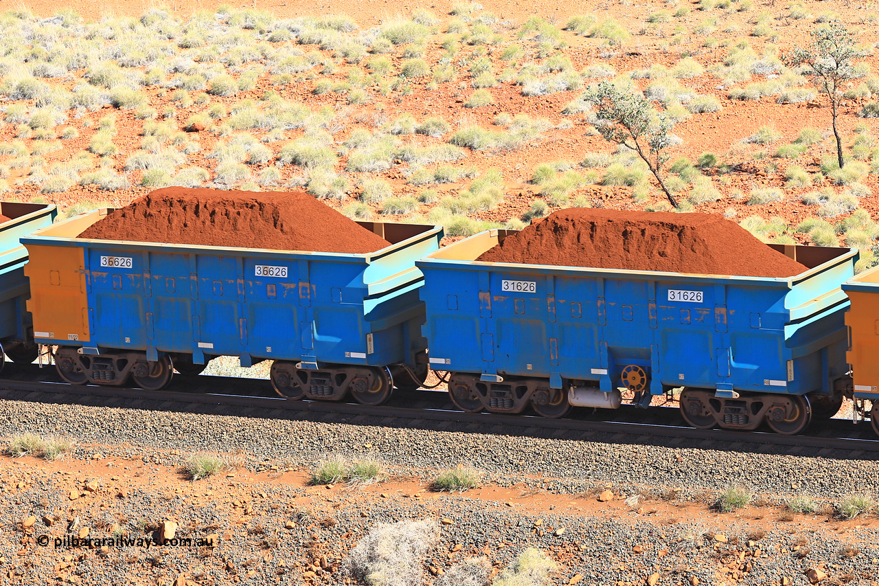 240701 2414
Western Creek, 67 km, one of Rio Tinto's blue rakes with spring assisted park brake and only electronic controlled pneumatic [ECP] braking, waggon pair 31626 is a master and is bar coupled to slave waggon 36626 built by China Northen as a Q type in 11/2022. Captured on July 1, 2024.
Keywords: 31626;36626;Q-type;China-Northern;Rio-ore-waggon;