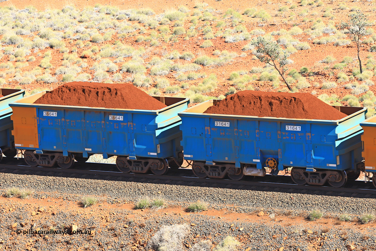 240701 2415
Western Creek, 67 km, one of Rio Tinto's blue rakes with spring assisted park brake and only electronic controlled pneumatic [ECP] braking, waggon pair 31641 is a master and is bar coupled to slave waggon 36641 built by China Northen as a Q type in 11/2022. Captured on July 1, 2024.
Keywords: 31641;36641;Q-type;China-Northern;Rio-ore-waggon;