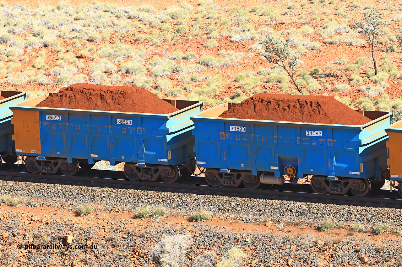 240701 2417
Western Creek, 67 km, one of Rio Tinto's blue rakes with spring assisted park brake and only electronic controlled pneumatic [ECP] braking, waggon pair 31593 is a master and is bar coupled to slave waggon 36593 built by China Northen as a Q type in 11/2022. Captured on July 1, 2024.
Keywords: 31593;36593;Q-type;China-Northern;Rio-ore-waggon;