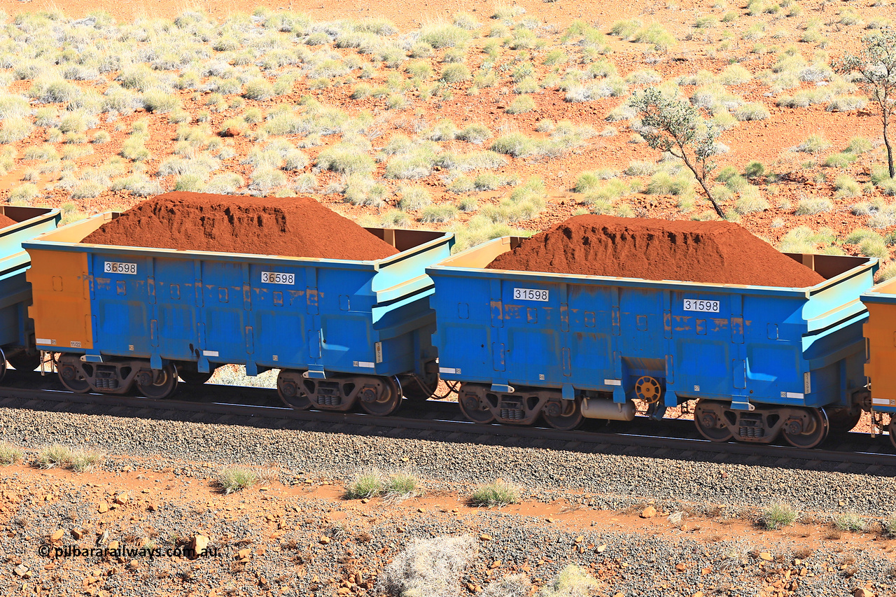 240701 2419
Western Creek, 67 km, one of Rio Tinto's blue rakes with spring assisted park brake and only electronic controlled pneumatic [ECP] braking, waggon pair 31598 is a master and is bar coupled to slave waggon 36598 built by China Northen as a Q type in 11/2022. Captured on July 1, 2024.
Keywords: 31598;36598;Q-type;China-Northern;Rio-ore-waggon;