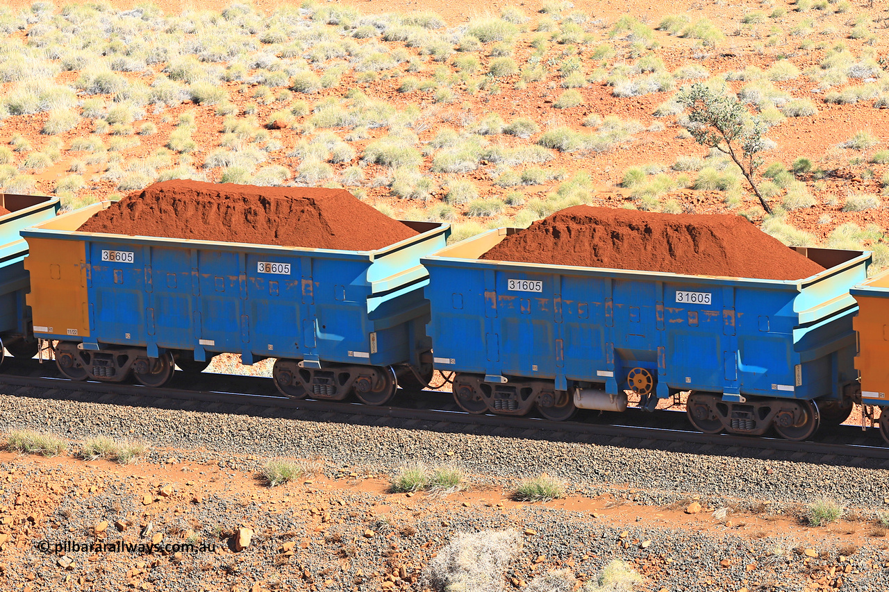 240701 2427
Western Creek, 67 km, one of Rio Tinto's blue rakes with spring assisted park brake and only electronic controlled pneumatic [ECP] braking, waggon pair 31605 is a master and is bar coupled to slave waggon 36605 built by China Northen as a Q type in 11/2022. Captured on July 1, 2024.
Keywords: 31605;36605;Q-type;China-Northern;Rio-ore-waggon;