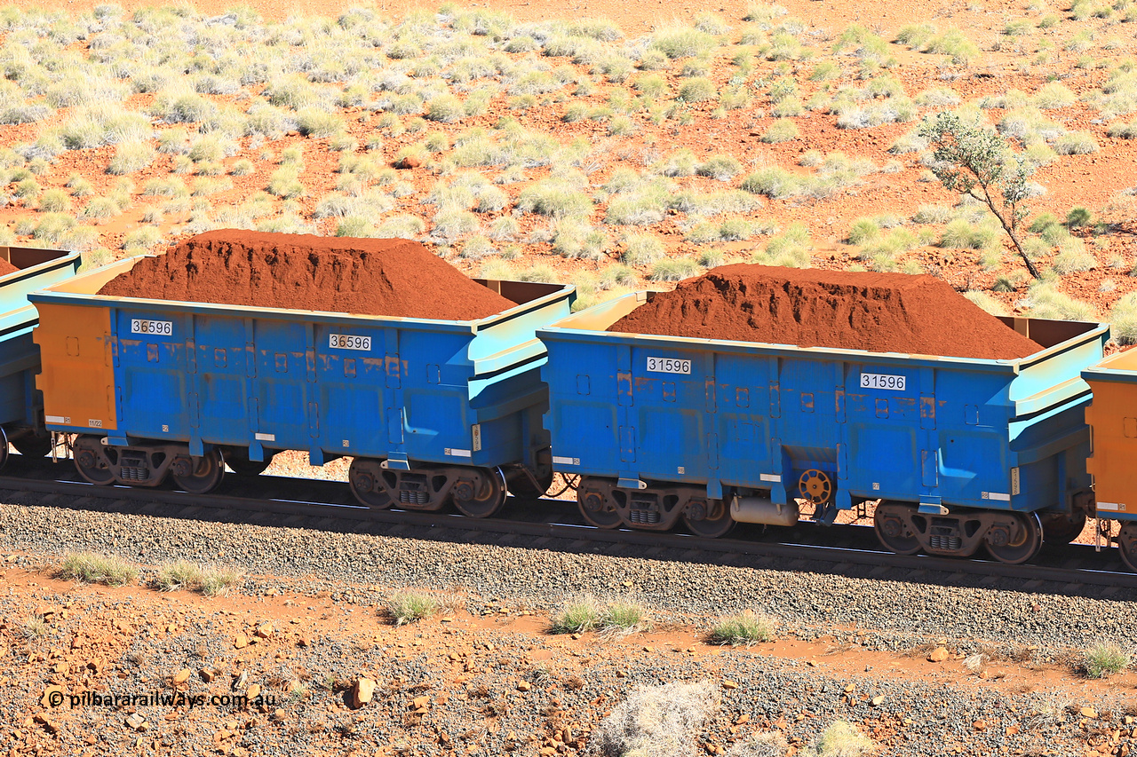 240701 2432
Western Creek, 67 km, one of Rio Tinto's blue rakes with spring assisted park brake and only electronic controlled pneumatic [ECP] braking, waggon pair 31596 is a master and is bar coupled to slave waggon 36596 built by China Northen as a Q type in 11/2022. Captured on July 1, 2024.
Keywords: 31596;36596;Q-type;China-Northern;Rio-ore-waggon;