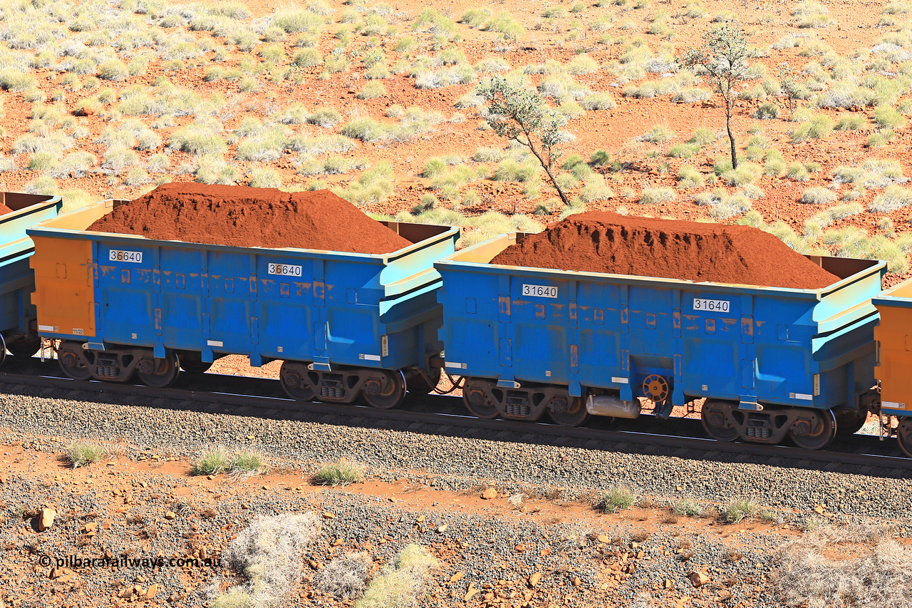 240701 2439
Western Creek, 67 km, one of Rio Tinto's blue rakes with spring assisted park brake and only electronic controlled pneumatic [ECP] braking, waggon pair 31640 is a master and is bar coupled to slave waggon 36640 built by China Northen as a Q type in 11/2022. Captured on July 1, 2024.
Keywords: 31640;36640;Q-type;China-Northern;Rio-ore-waggon;