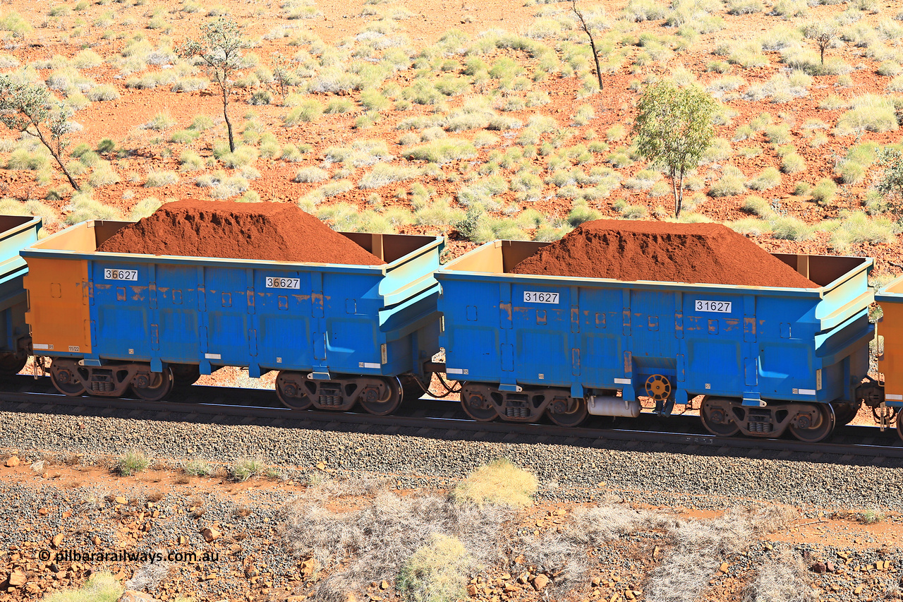 240701 2442
Western Creek, 67 km, one of Rio Tinto's blue rakes with spring assisted park brake and only electronic controlled pneumatic [ECP] braking, waggon pair 31627 is a master and is bar coupled to slave waggon 36627 built by China Northen as a Q type in 11/2022. Captured on July 1, 2024.
Keywords: 31627;36627;Q-type;China-Northern;Rio-ore-waggon;