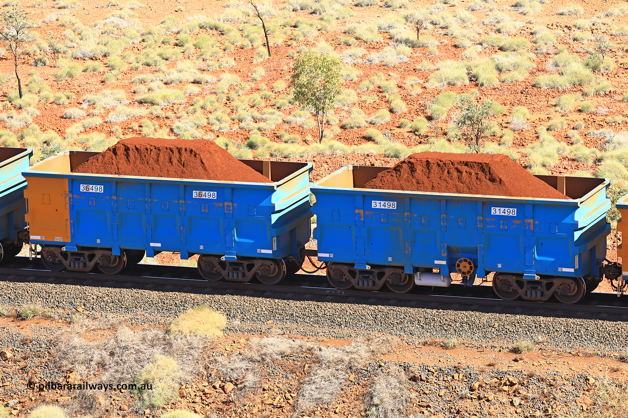 240701 2444
Western Creek, 67 km, one of Rio Tinto's blue rakes with spring assisted park brake and only electronic controlled pneumatic [ECP] braking, waggon pair 31498 is a master and is bar coupled to slave waggon 36498 built by China Northen as a Q type in 12/2022. Captured on July 1, 2024.
Keywords: 31498;36498;Q-type;China-Northern;Rio-ore-waggon;