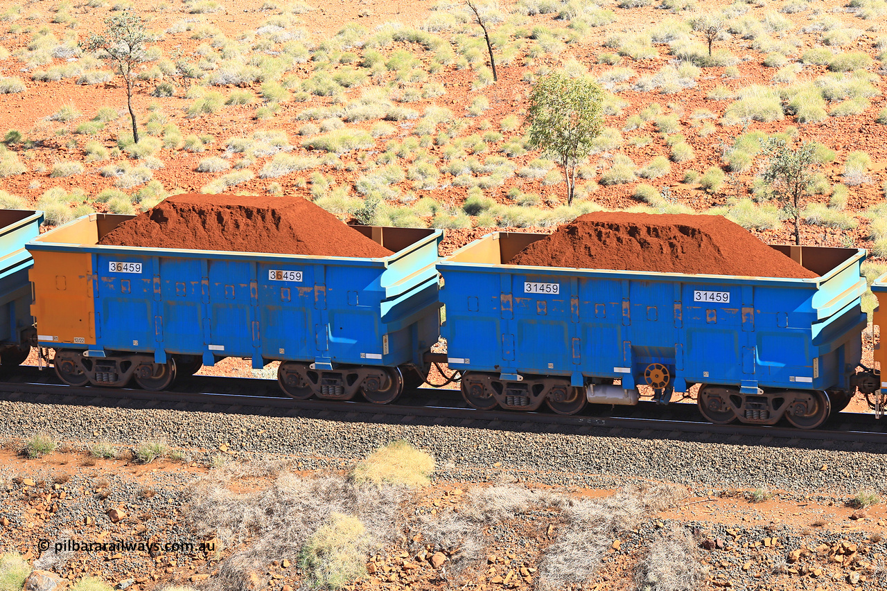 240701 2446
Western Creek, 67 km, one of Rio Tinto's blue rakes with spring assisted park brake and only electronic controlled pneumatic [ECP] braking, waggon pair 31459 is a master and is bar coupled to slave waggon 36459 built by China Northen as a Q type in 12/2022. Captured on July 1, 2024.
Keywords: 31459;36459;Q-type;China-Northern;Rio-ore-waggon;