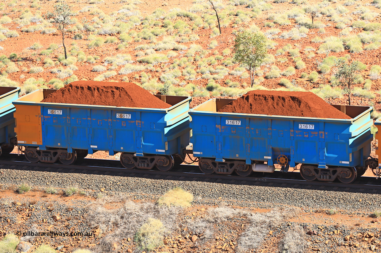 240701 2448
Western Creek, 67 km, one of Rio Tinto's blue rakes with spring assisted park brake and only electronic controlled pneumatic [ECP] braking, waggon pair 31617 is a master and is bar coupled to slave waggon 36617 built by China Northen as a Q type in 11/2022. Captured on July 1, 2024.
Keywords: 31617;36617;Q-type;China-Northern;Rio-ore-waggon;