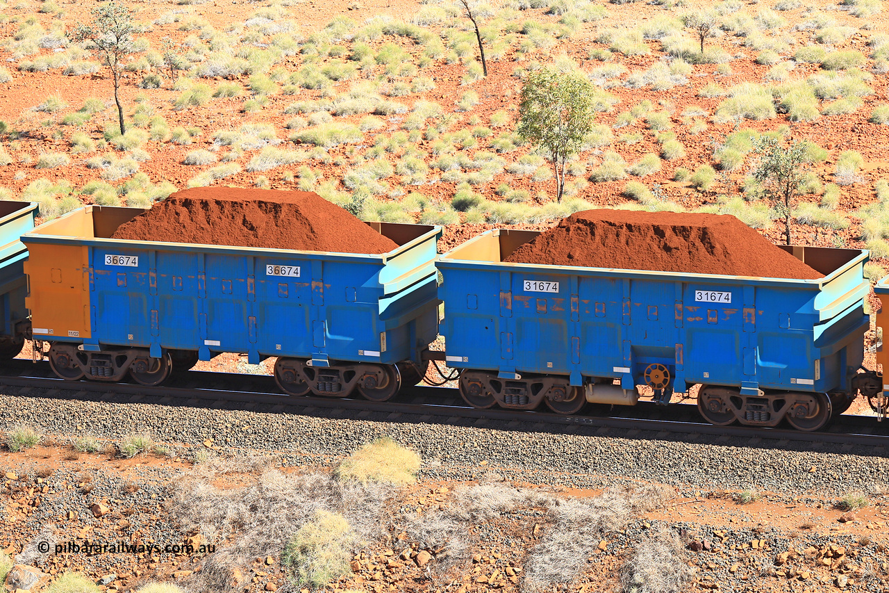240701 2449
Western Creek, 67 km, one of Rio Tinto's blue rakes with spring assisted park brake and only electronic controlled pneumatic [ECP] braking, waggon pair 31674 is a master and is bar coupled to slave waggon 36674 built by China Northen as a Q type in 11/2022. Captured on July 1, 2024.
Keywords: 31674;36674;Q-type;China-Northern;Rio-ore-waggon;