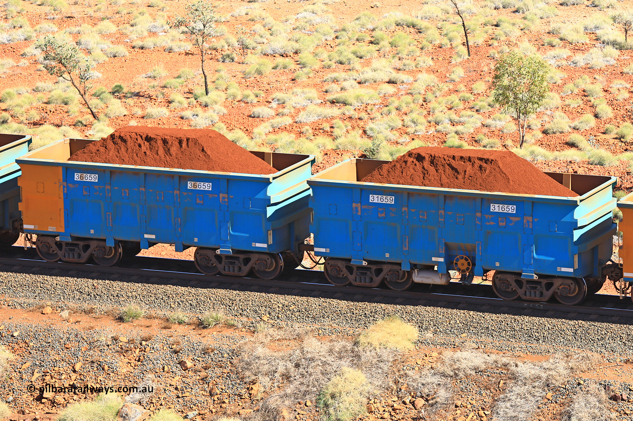 240701 2465
Western Creek, 67 km, one of Rio Tinto's blue rakes with spring assisted park brake and only electronic controlled pneumatic [ECP] braking, waggon pair 31659 is a master and is bar coupled to slave waggon 36659 built by China Northen as a Q type in 11/2022. Captured on July 1, 2024.
Keywords: 31659;36659;Q-type;China-Northern;Rio-ore-waggon;