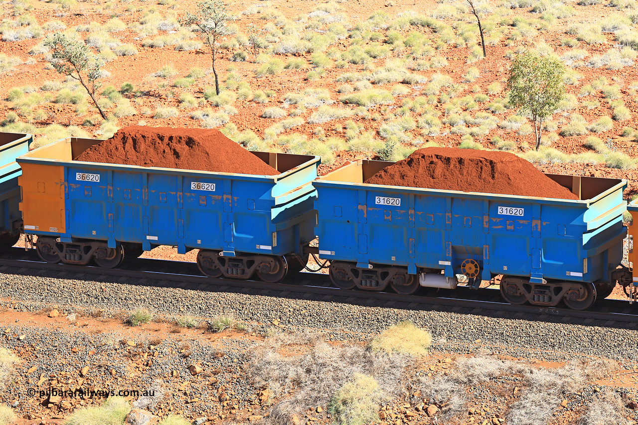 240701 2467
Western Creek, 67 km, one of Rio Tinto's blue rakes with spring assisted park brake and only electronic controlled pneumatic [ECP] braking, waggon pair 31620 is a master and is bar coupled to slave waggon 36620 built by China Northen as a Q type in 11/2022. Captured on July 1, 2024.
Keywords: 31620;36620;Q-type;China-Northern;Rio-ore-waggon;