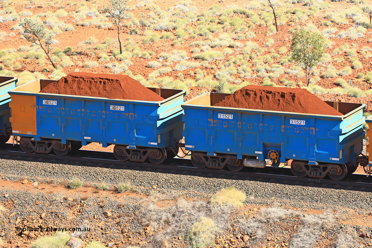 240701 2473
Western Creek, 67 km, one of Rio Tinto's blue rakes with spring assisted park brake and only electronic controlled pneumatic [ECP] braking, waggon pair 31521 is a master and is bar coupled to slave waggon 36521 built by China Northen as a Q type in 12/2022. Captured on July 1, 2024.
Keywords: 31521;36521;Q-type;China-Northern;Rio-ore-waggon;