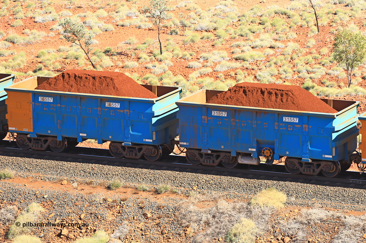 240701 2476
Western Creek, 67 km, one of Rio Tinto's blue rakes with spring assisted park brake and only electronic controlled pneumatic [ECP] braking, waggon pair 31557 is a master and is bar coupled to slave waggon 36557 built by China Northen as a Q type in 12/2022. Captured on July 1, 2024.
Keywords: 31557;36557;Q-type;China-Northern;Rio-ore-waggon;