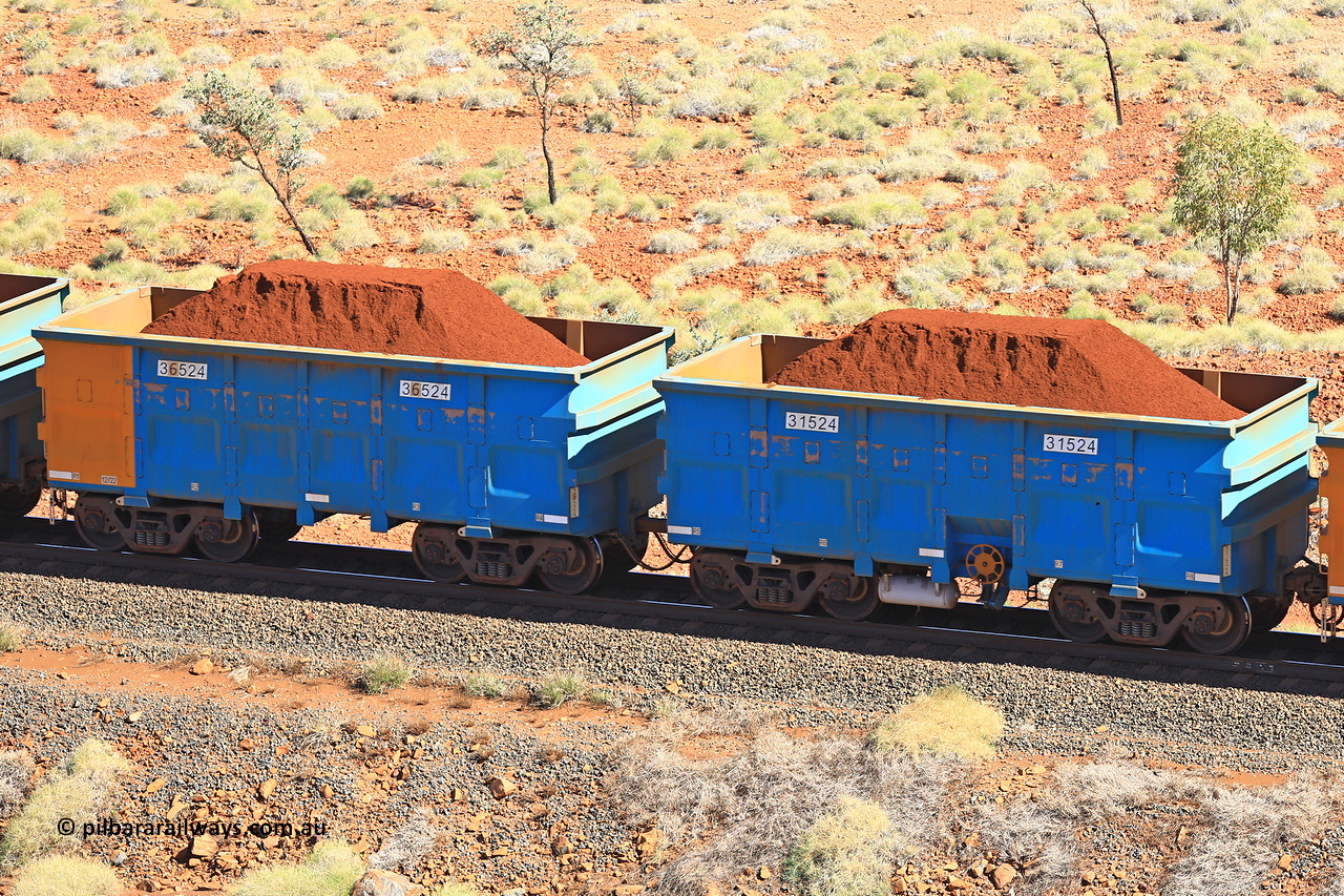 240701 2478
Western Creek, 67 km, one of Rio Tinto's blue rakes with spring assisted park brake and only electronic controlled pneumatic [ECP] braking, waggon pair 31524 is a master and is bar coupled to slave waggon 36524 built by China Northen as a Q type in 12/2022. Captured on July 1, 2024.
Keywords: 31524;36524;Q-type;China-Northern;Rio-ore-waggon;
