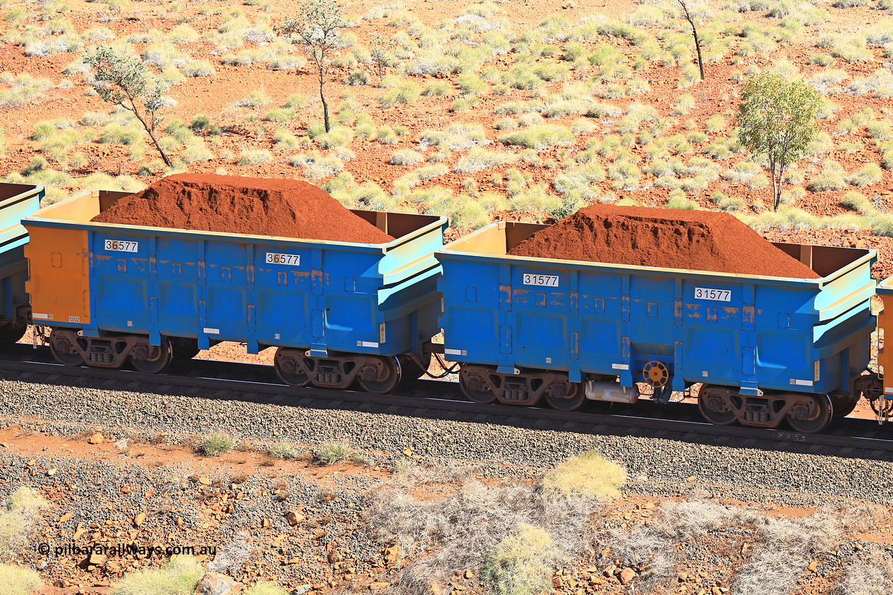 240701 2479
Western Creek, 67 km, one of Rio Tinto's blue rakes with spring assisted park brake and only electronic controlled pneumatic [ECP] braking, waggon pair 31577 is a master and is bar coupled to slave waggon 36577 built by China Northen as a Q type in 12/2022. Captured on July 1, 2024.
Keywords: 31577;36577;Q-type;China-Northern;Rio-ore-waggon;