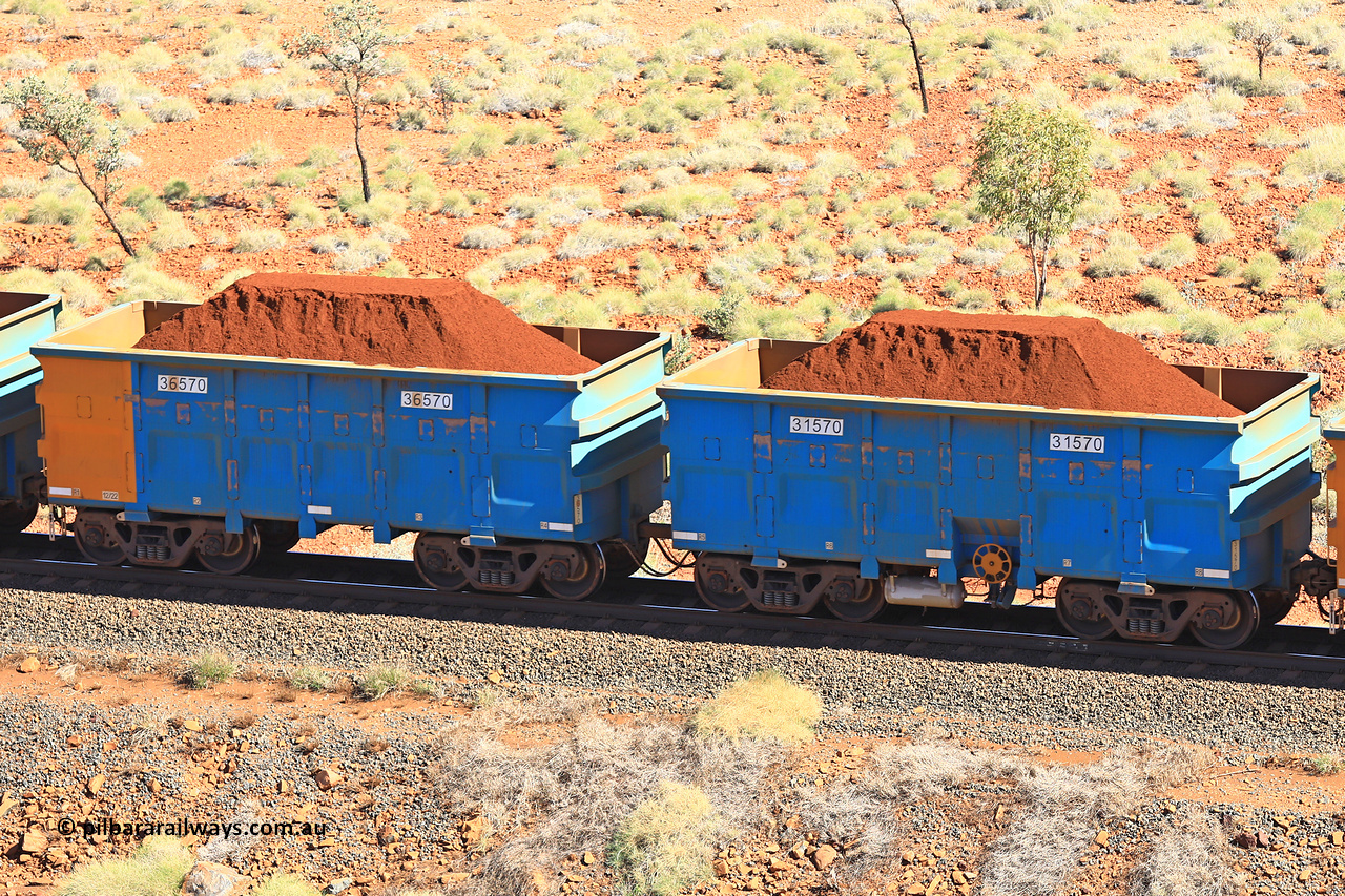 240701 2484
Western Creek, 67 km, one of Rio Tinto's blue rakes with spring assisted park brake and only electronic controlled pneumatic [ECP] braking, waggon pair 31570 is a master and is bar coupled to slave waggon 36570 built by China Northen as a Q type in 12/2022. Captured on July 1, 2024.
Keywords: 31570;36570;Q-type;China-Northern;Rio-ore-waggon;