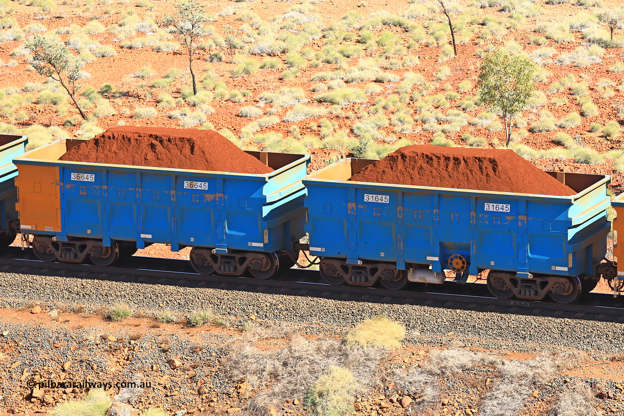 240701 2489
Western Creek, 67 km, one of Rio Tinto's blue rakes with spring assisted park brake and only electronic controlled pneumatic [ECP] braking, waggon pair 31645 is a master and is bar coupled to slave waggon 36645 built by China Northen as a Q type in 11/2022. Captured on July 1, 2024.
Keywords: 31645;36645;Q-type;China-Northern;Rio-ore-waggon;