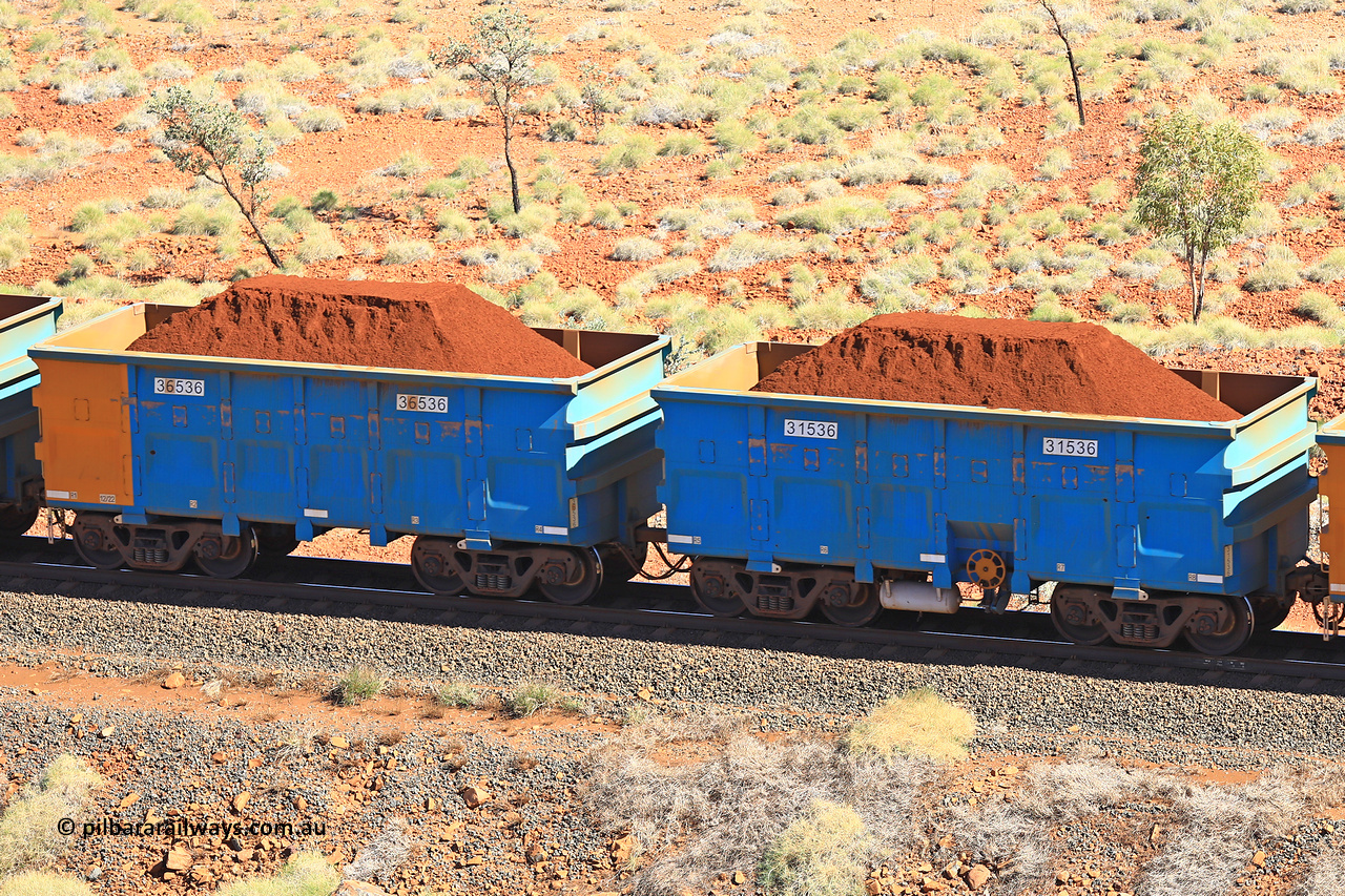 240701 2494
Western Creek, 67 km, one of Rio Tinto's blue rakes with spring assisted park brake and only electronic controlled pneumatic [ECP] braking, waggon pair 31536 is a master and is bar coupled to slave waggon 36536 built by China Northen as a Q type in 12/2022. Captured on July 1, 2024.
Keywords: 31536;36536;Q-type;China-Northern;Rio-ore-waggon;