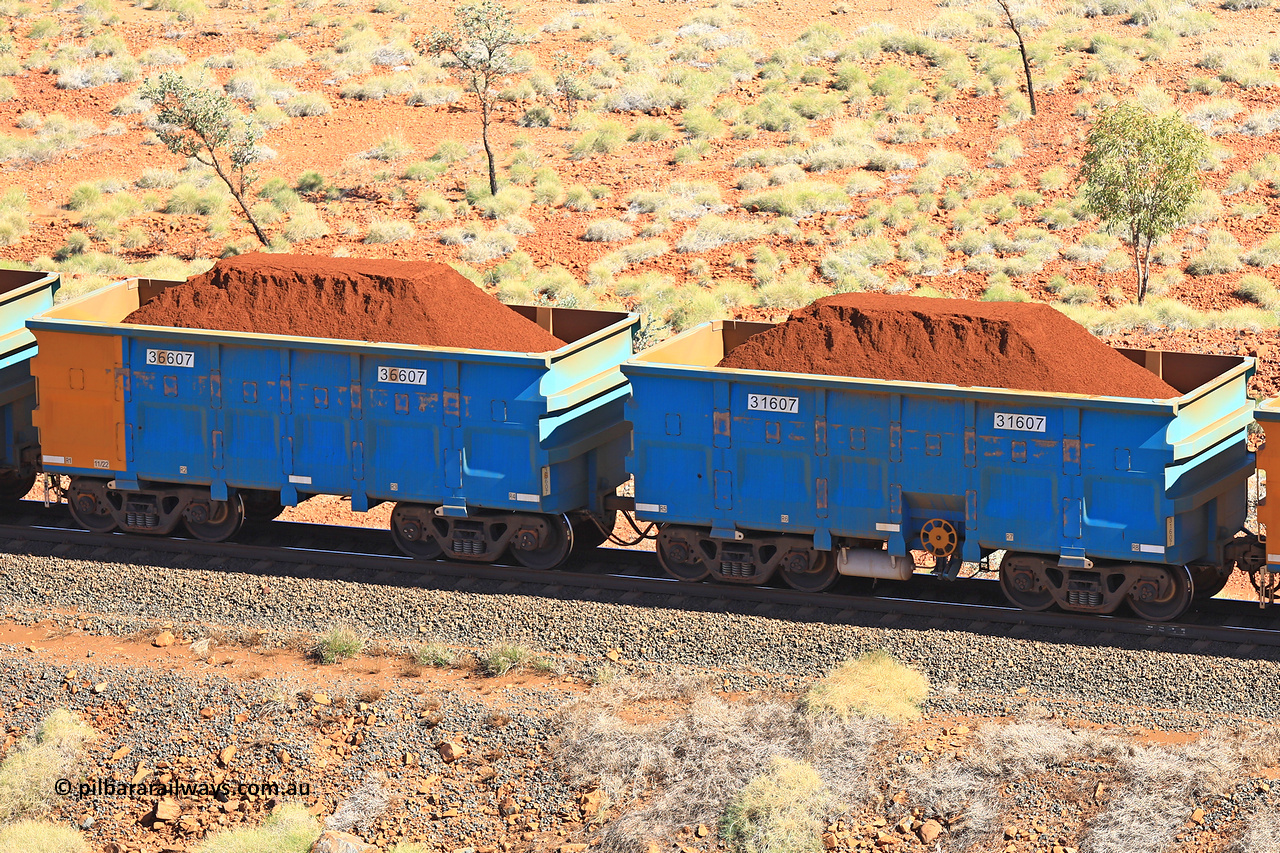 240701 2499
Western Creek, 67 km, one of Rio Tinto's blue rakes with spring assisted park brake and only electronic controlled pneumatic [ECP] braking, waggon pair 31607 is a master and is bar coupled to slave waggon 36607 built by China Northen as a Q type in 11/2022. Captured on July 1, 2024.
Keywords: 31607;36607;Q-type;China-Northern;Rio-ore-waggon;