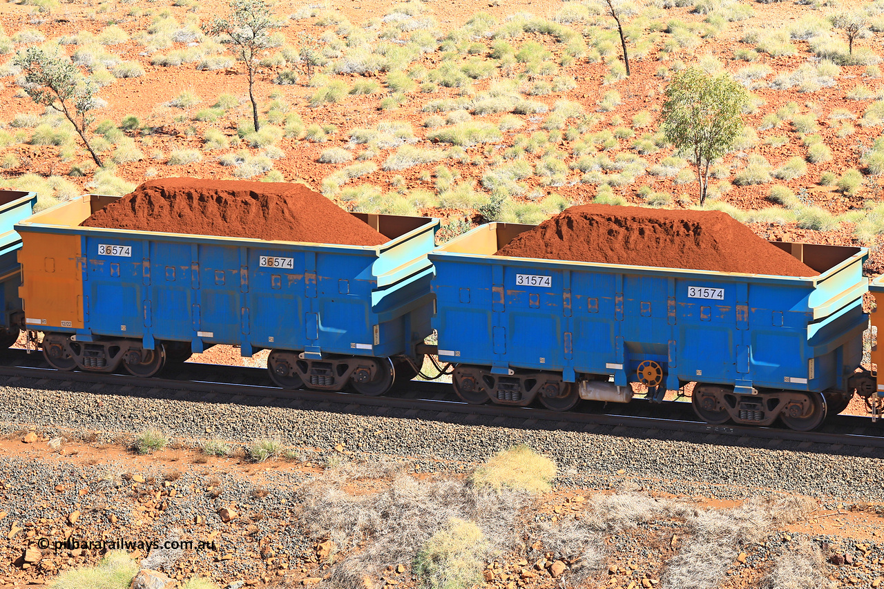 240701 2502
Western Creek, 67 km, one of Rio Tinto's blue rakes with spring assisted park brake and only electronic controlled pneumatic [ECP] braking, waggon pair 31574 is a master and is bar coupled to slave waggon 36574 built by China Northen as a Q type in 11/2022. Captured on July 1, 2024.
Keywords: 31574;36574;Q-type;China-Northern;Rio-ore-waggon;