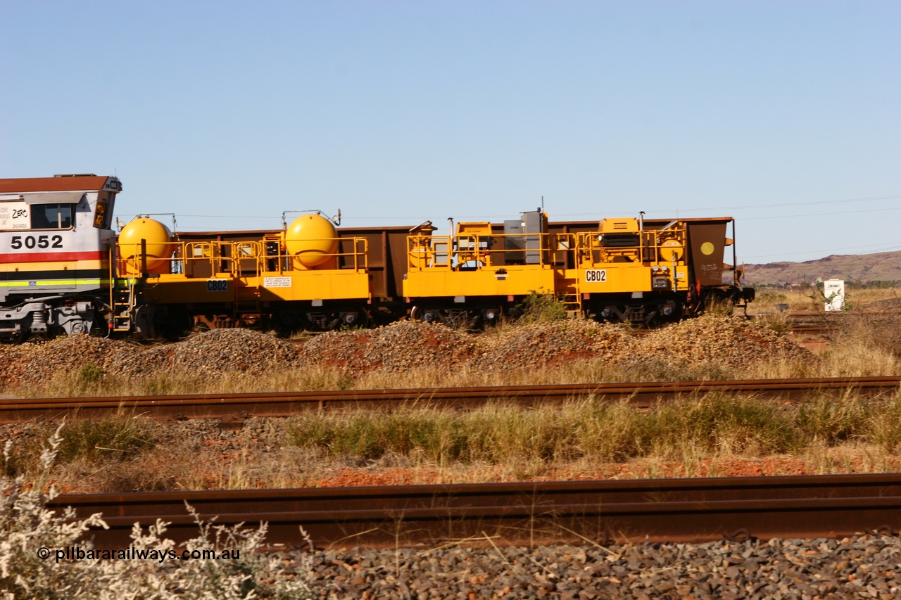 060723 7828
Rio Tinto compressor waggon set CB 02, compressor control waggon with two diesel powered Atlas Copco XAS 97's and the receiver waggon with two air tanks or receivers. Note the waggons are cut down ore waggons. Seen here inside 7 Mile. 23rd July 2006.
Keywords: CB02;rio-compressor-waggon;
