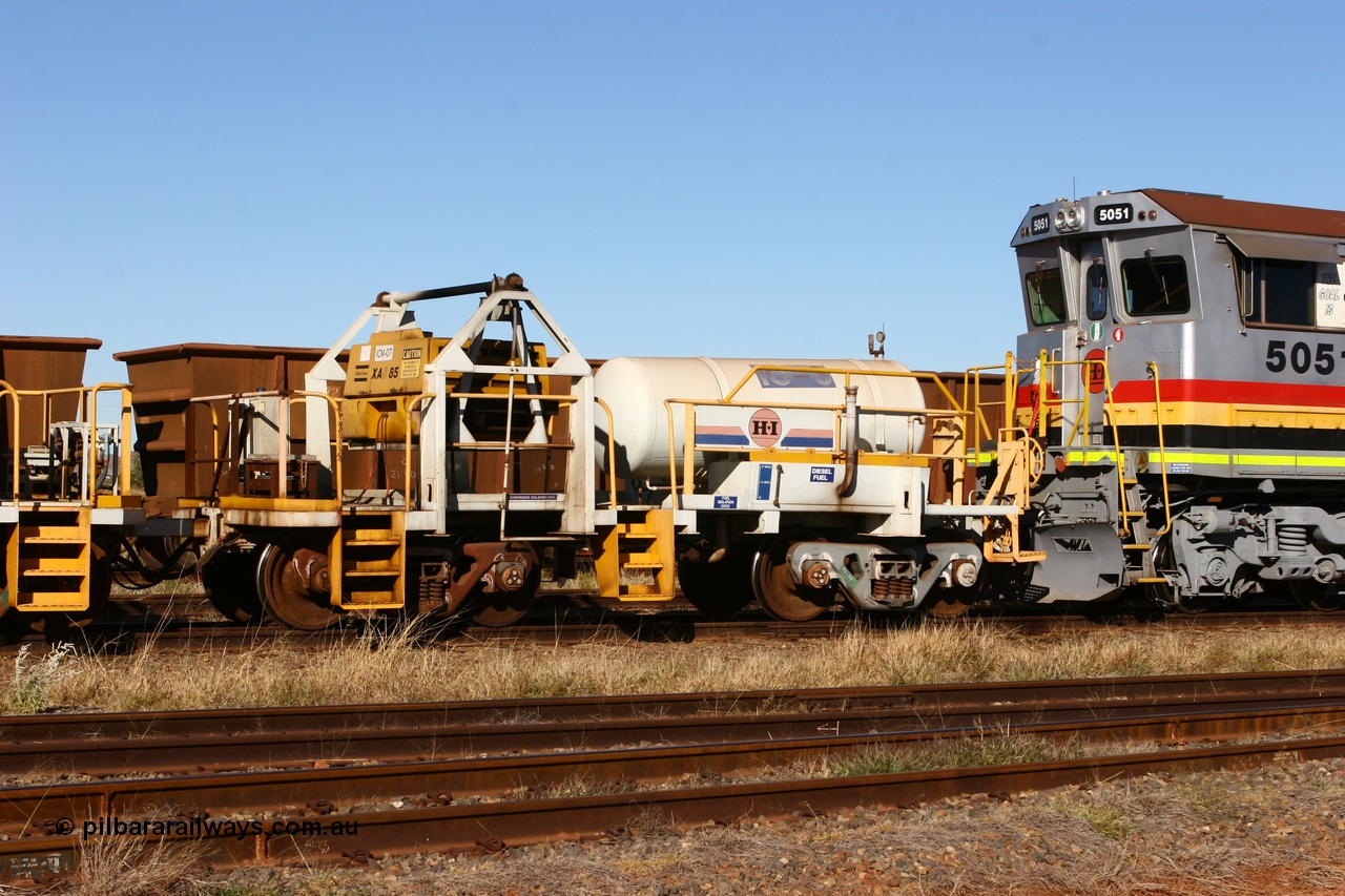 060723 7844
Original Hamersley Iron compressor waggon set IC-3 which were made from cutting down condemned ore waggons and then fitting Atlas Copco XAS 97 air compressors, receiver tanks and fuel tanks. The compressors have been fitted to a swing cradle to limit the in-train forces during the unloading process. 7 Mile 23rd July 2006.
Keywords: IC-3;rio-compressor-waggon;