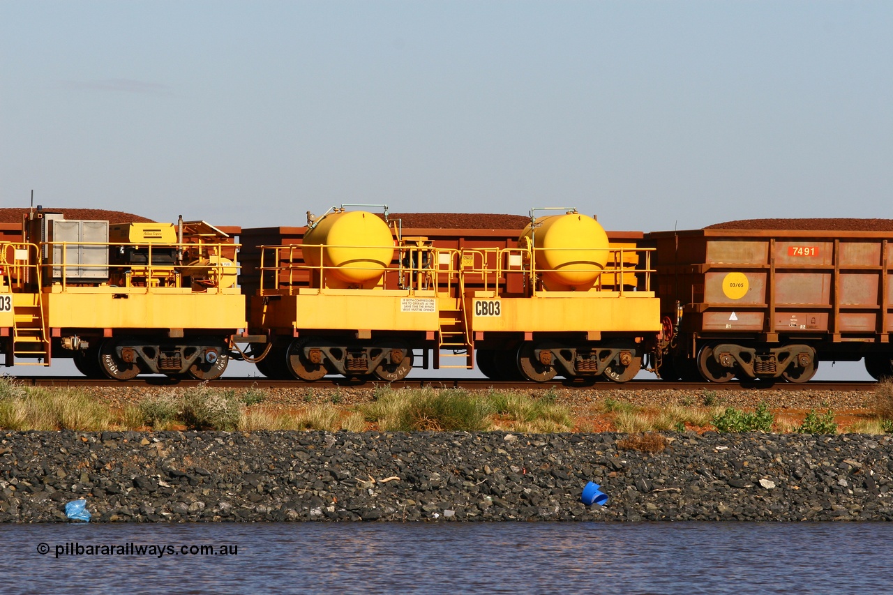110602 8647
Rio Tinto compressor waggon set CB 03, receiver waggon with two air tanks or receivers. These are built on former ore waggons that have been cut down. Seen here on the causeway just outside of 7 Mile. 2nd June 2011.
Keywords: CB03;rio-compressor-waggon;