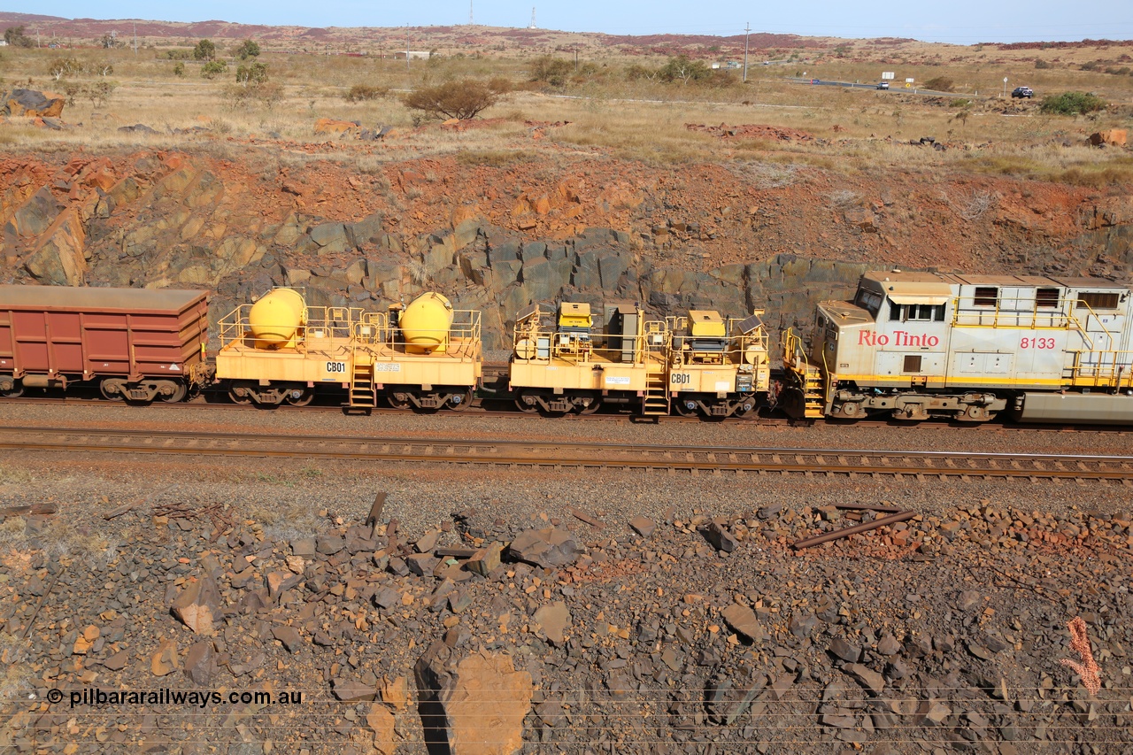141124 7078
Rio Tinto compressor waggon set leader CB 01, compressor control waggon with two diesel powered Atlas Copco XAS 97's behind the loco and the receiver waggon with two air tanks or receivers. Note the waggons are cut down ore waggons. Seen here at Parker Point, Dampier on 24th November 2014.
Keywords: CB01;rio-compressor-waggon;