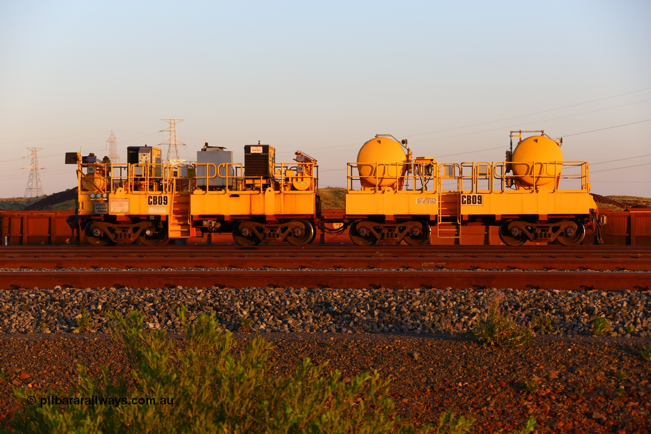 170510 8282
Rio Tinto compressor waggon set CB 09, compressor control waggon with two diesel powered Kaeser M57 Utility air compressors and the receiver waggon with two air tanks or receivers. Note the waggons are modified ore waggon frames. Seen here at Cape Lambert. 10th May 2017.
Keywords: CB09;rio-compressor-waggon;