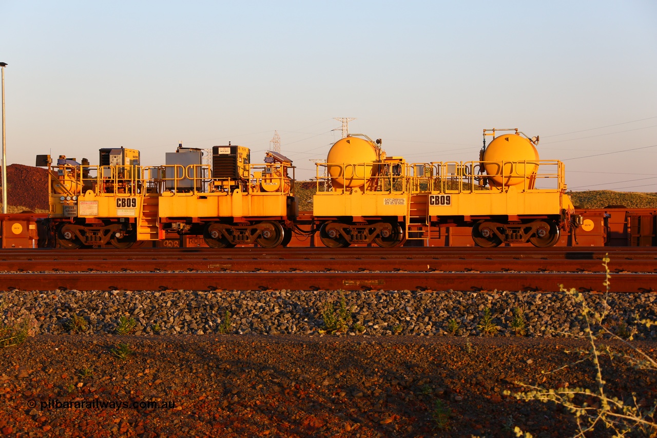 170510 8294
Rio Tinto compressor waggon set CB 09, compressor control waggon with two diesel powered Kaeser M57 Utility air compressors and the receiver waggon with two air tanks or receivers. Note the waggons are modified ore waggon frames. Seen here at Cape Lambert. 10th May 2017.
Keywords: CB09;rio-compressor-waggon;