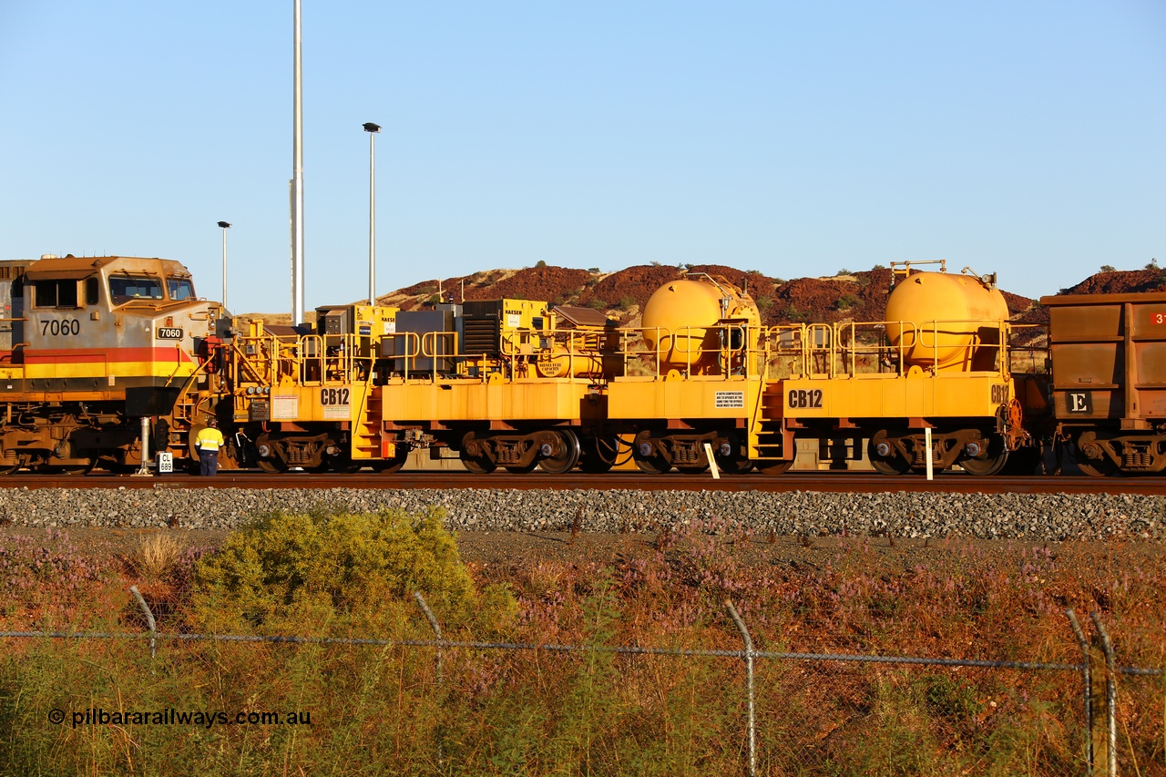 170728 09678
Rio Tinto compressor waggon set CB 12, compressor control waggon with two diesel powered Kaeser M57 Utility air compressors and the receiver waggon with two air tanks or receivers. Note the waggons are modified ore waggon frames. Seen here at Cape Lambert. 28th July 2017.
Keywords: CB12;rio-compressor-waggon;