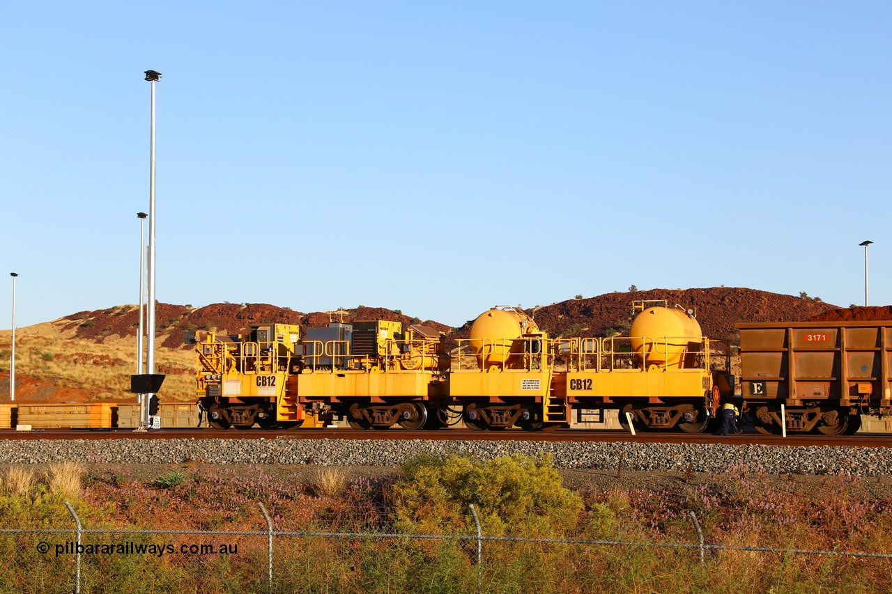 170728 09687
Rio Tinto compressor waggon set CB 12, compressor control waggon with two diesel powered Kaeser M57 Utility air compressors and the receiver waggon with two air tanks or receivers. Note the waggons are modified ore waggon frames. Seen here at Cape Lambert. 28th July 2017.
Keywords: CB12;rio-compressor-waggon;