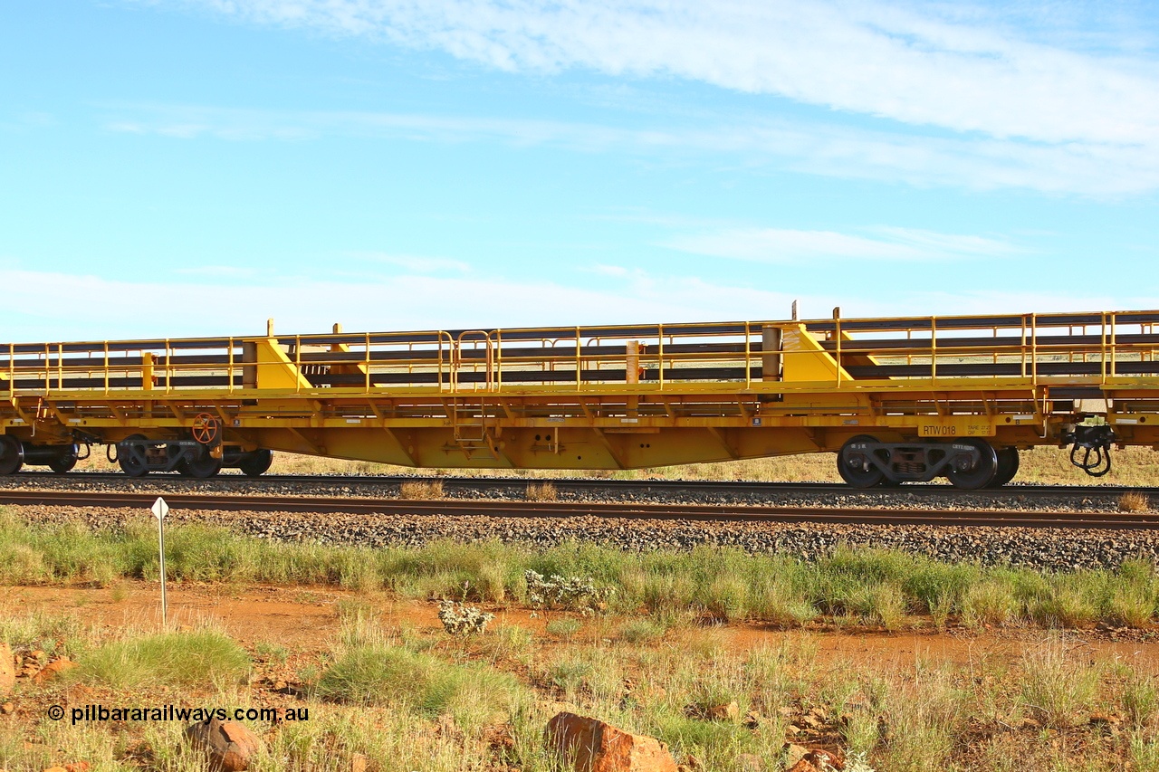 210510 1102
Near Gull on the Rio Tinto Dampier - Tom Price line at the 101.5 km, RTW type intermediate rail waggon RTW 018 on Rio Tinto's Gemco Rail built rail train consist. 10th May 2021. [url=https://goo.gl/maps/9WbRn1E4vP6a1YbN8]Location[/url].
Keywords: RTW-type;RTW018;Gemco-Rail-WA;