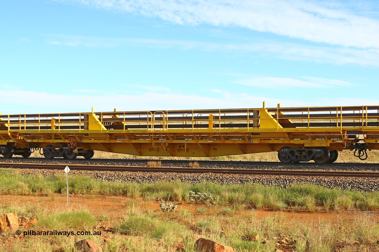 210510 1109
Near Gull on the Rio Tinto Dampier - Tom Price line at the 101.5 km, RTW type intermediate rail waggon RTW 011 on Rio Tinto's Gemco Rail built rail train consist. 10th May 2021. [url=https://goo.gl/maps/9WbRn1E4vP6a1YbN8]Location[/url].
Keywords: RTW-type;RTW011;Gemco-Rail-WA;